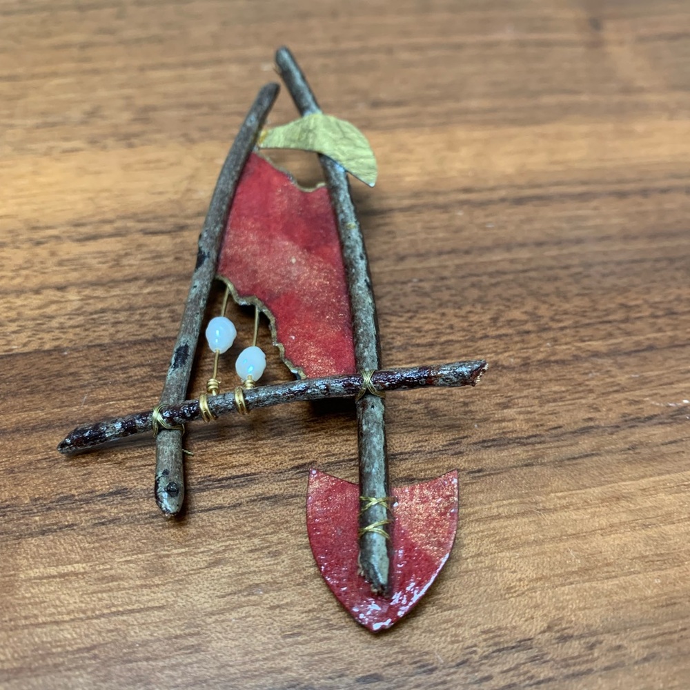 Found objects brooch made with sticks, paper, wire, and fresh water pearls